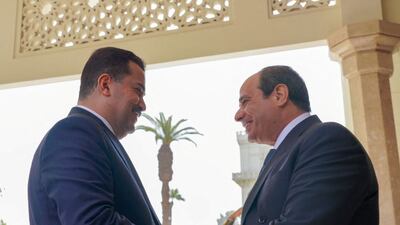 Mohammed Shia Al Sudani (L) meets Abdel Fattah El Sisi in Cairo on Sunday. Photo: Media Office of the Prime Minister via Reuters