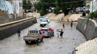 It's wading rather than walking for most of Sanaa's pedestrians. AFP