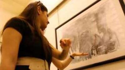 Women discuss a painting by the Iraqi artist Balasem Mohammed at the Dar Al Anda Gallery in Amman this month.