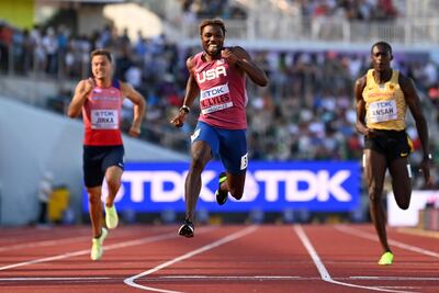 Noah Lyles crosses the finish line ahead of Jan Jirka and Owen Ansah to win his 200m heat at the World Athletics Championships. AFP