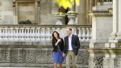 Prince William and Catherine, Duchess of Cambridge walk hand in hand from Buckingham Palace the day after their wedding to a waiting helicopter as they leave for a secret honeymoon location. Getty Images