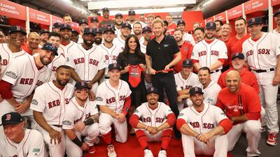 LONDON, ENGLAND - JUNE 29: In this handout image provided by The Invictus Games Foundation, Prince Harry, Duke of Sussex and Meghan, Duchess of Sussex join the Boston Red Sox in their Clubhouse and receive gifts for Archie ahead of their match against the New York Yankees at the London Stadium in London, England. The historic two-game "You Just Cant Beat The Person Who Never Gives Up" series marks the sports first games ever played in Europe and The Invictus Games Foundation has been selected as the official charity of Mitel and MLB London Series 2019. Getty Images
