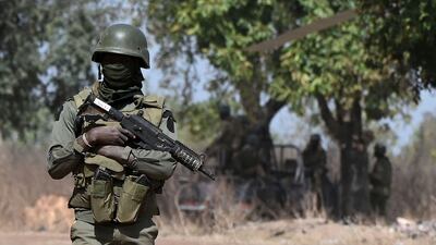 A soldier provides security for the visit of Ivorian Prime Minister Patrick Achi to the region bordering Mali and Burkina Faso, where extremist groups are a threat. AFP