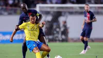 Paris Saint-Germain's Danilo Pereira fights for the ball with Al Nassr's Cristiano Ronaldo during their friendly at the Nagai Stadium in Osaka on Tuesday, July 25, 2023. AFP