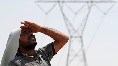 Sweltering heat near Hilla city, in central Iraq, as parts of the country were hit by power cuts. AFP
