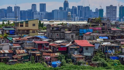 Residential and commercial buildings in Manila. Philippines President-elect Ferdinand Marcos Jr Ros has chosen a new cabinet to try to revive the economy. AFP