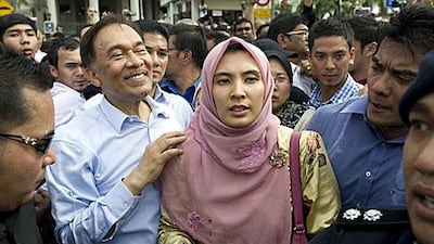 Anwar Ibrahim, the opposition leader, smiles outside of court with his daughter, Nurul Izzah, after being cleared in a sodomy trial which has gripped Malaysian politics.