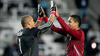 Renny Vega,the Venezuela goalkeeper, and teammate Grenddy Perozo celebrate their draw against Brazil.