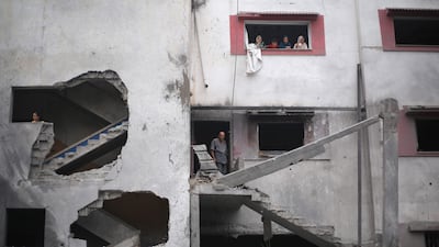 A housing block was hit by air strikes after the Israeli military ordered residents to leave Al Zawayda, central Gaza, overnight. AFP