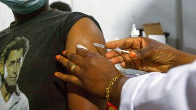 A patient receives a Covid-19 vaccine in Ivory Coast, which welcomed its first batch of vaccines from the Covax programme in February. Many low and middle-income countries have yet to receive doses. AP