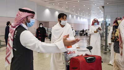 A mask-clad Pakistani traveller arriving in Saudi Arabia to perform the year-round Umrah. AFP