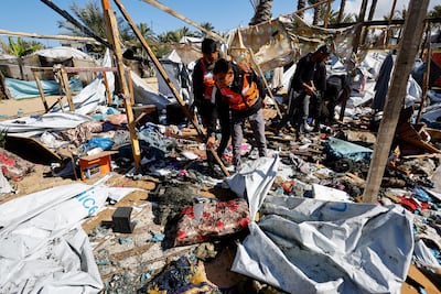 Civil Defence officers inspect the site of an Israeli bombing in Khan Younis, in the southern Gaza Strip, on Wednesday. Reuters