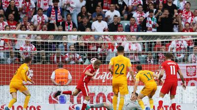 Karol Swiderski of Poland scores his team's second goal. Getty
