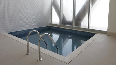 An indoor pool in the 64th floor penthouse apartment in Aldar's Gate Tower development on Reem Island. Photo by Clint McLean for The National