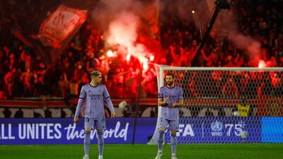 Real Madrid's Federico Valverde and Nacho look dejected after Al Ahly's Ali Maaloul scores their first goal. Reuters