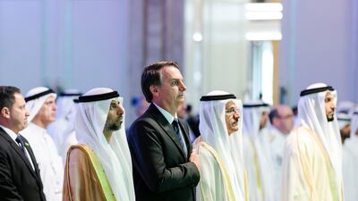 Jair Bolsonaro, president of Brazil, stands for the national anthem at the UAE-Brazil Business Forum. Reem Mohammed / The National
