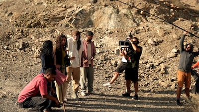 Abdullah Bin Haider, centre, films a scene for Emirati supernatural series Kaa’inaat, shot in Ras Al Khaimah and Fujairah. Photo: Starzplay