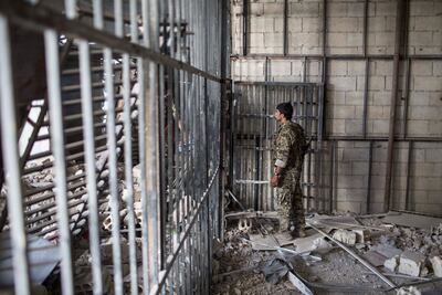 Members of the Syrian Democratic Forces in the Stadium Prison after ISIS were defeated in Raqqa in 2017. AP