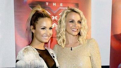 Demi Lovato and Britney Spears. Tim Mosenfelder / Getty Images / AFP