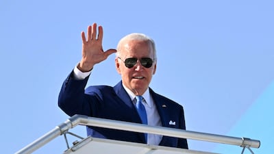 US President Joe Biden waves from a plane at King Abdulaziz International Airport in Jeddah. AFP