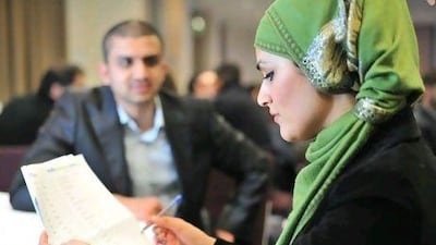 Nighat Bishir makes some notes on her checklist at a Muslim Marriage Event in east London. Jas Lehal for The National