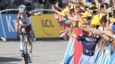 Romain Bardet of France celebrates as he crosses the finish line to win Stage 18 of the Tour de France on Thursday in Saint-Jean-De-Maurienne. Peter Dejong / AP