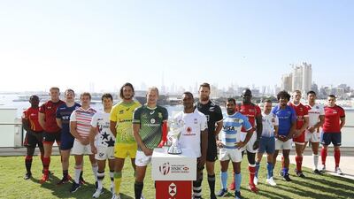 The captains of the World Rugby Seven Series teams pose with the Emirates Airline Dubai Rugby Sevens trophy ahed of the tournament. Courtesy: HSBC World Rugby Sevens Series
