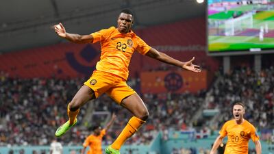 Denzel Dumfries of the Netherlands celebrates scoring his side's 3rd goal during the World Cup round of 16 soccer match between the Netherlands and the United States, at the Khalifa International Stadium in Doha, Qatar. AP Photo
