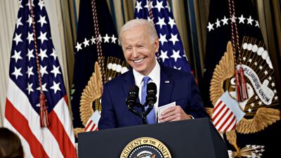 Mr Biden was all smiles during a news conference in the White House. Bloomberg