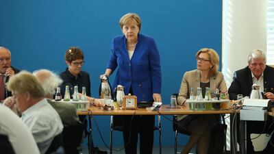 German Chancellor and leader of the German Christian Democrats (CDU) Angela Merkel pours coffee as she for an early morning meeting of the CDU governing board. Sean Gallup/ Getty Images
