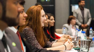 Pupils take part in a model UN round-table debate on female unemployment in Mena and the refugee crisis. Anna Nielsen for The National