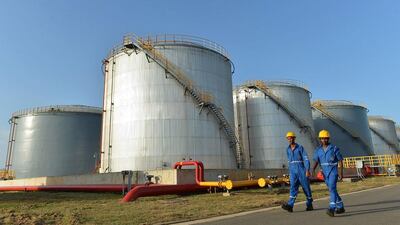 Sri Lankan workers at Hambantota port’s oil tank farm. India recently unveiled a road map for economic cooperation with Sri Lanka, of which the energy sector is central. Ishara S Kodikara / AFP