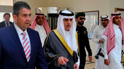 Saudi Arabia's foreign minister Adel Al Jubeir, centre, walking with his German counterpart Sigmar Gabriel in the Red Sea resort of Jeddah on July 3, 2017. The two leaders met to discuss the ongoing crisis in the Gulf where Saudi Arabia, the UAE, Bahrain and Egypt have cut ties with Qatar over its support for terrorism. AFP Photo