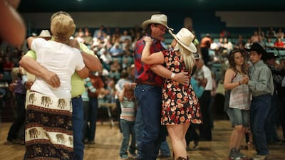 People dance to a band during the annual fiesta in Truth or Consequences, New Mexico. Many agree that Spaceport America should inject new energy into the town. Lucy Nicholson / Reuters