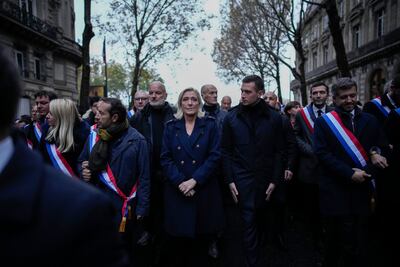 Marine Le Pen, centre, joins a march against anti-Semitism in Paris. AP