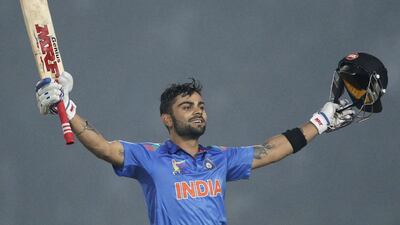 India’s captain Virat Kohli celebrates after reaching his 19th century in ODIs on Wednesday, February 26, 2014. Andrew Biraj / Reuters