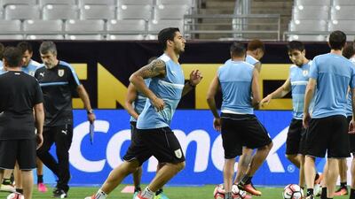 Uruguay player Luis Suarez shown at a training session on Saturday ahead of his team's Copa America opener against Mexico. Coach Oscar Tabarez says he will not be fit to play. Nelson Almeida / AFP / June 4, 2016