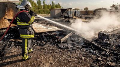 Firefighters said at least ten people had been injured in the blaze at the camp, which was home to some 1,600 people. Philippe Huguen/AFP