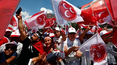 Supporters of the Nationalist Movement Party, or MHP, wave flags during an election rally in Ankara, Turkey, on June 23, 2018. Burhan Ozbilici / AP Photo