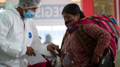 A health worker and a woman in discussion after the latter received a dose of the Sputnik V vaccine at the Universidad Publica de El Alto, during a vaccination drive for people over 60 in El Alto, Bolivia. AP Photo