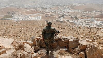 A Lebanese soldier stands at an army post in the hills above the Lebanese town of Arsal, near the border with Syria, on September 21, 2016. Mohamed Azakir / Reuters