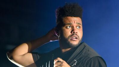 FILE - The Weeknd performs on day three at Lollapalooza in Grant Park in Chicago on Aug 4, 2018. The Weekend, nominated for six MTV Video Music Awards will perform at the awards show on Aug. 30. (Photo by Rob Grabowski/Invision/AP, File)