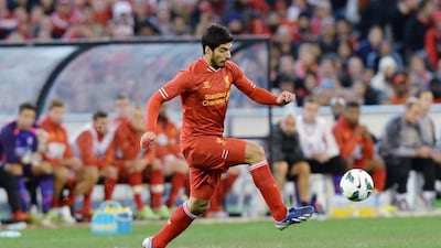 Luis Suarez was handed a 10-match suspension after biting Chelsea's Branislav Ivanovic last season. Mal Fairclough / AFP