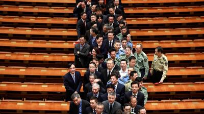 Attendees leave the hall after an event celebrating the 200th year anniversary of the birth of German philosopher Karl Marx at the Great Hall of the People (GHOP) in Beijing, China. How Hwee Young / EPA