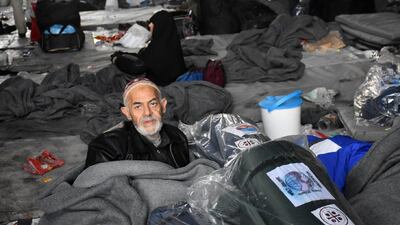 Syrians who fled from rebel-held areas in east Aleppo sleep in a warehouse in Duweirineh, a small village on the eastern outskirts of the embattled city, on December 1, 2016. George Ourfalian / AFP
