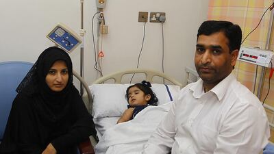 Shaheera Faheem has her monthly blood transfusion with her mother, Beenish Hassan, and father, Faheem Sultan, at her bedside. A bone-marrow transplant could help her but it is an expensive procedure. Jeffrey E Biteng / The National
