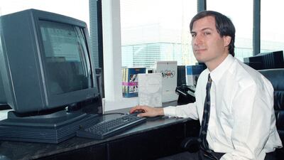 FILE - In this April 4, 1991, file photo, Steve Jobs, of NeXT Computer Inc., poses with his NeXT station color computer for the press at the NeXT facility in Redwood City, Calif. Jobs had left Apple Inc. in 1985 and would not return until 1997. (AP Photo/???