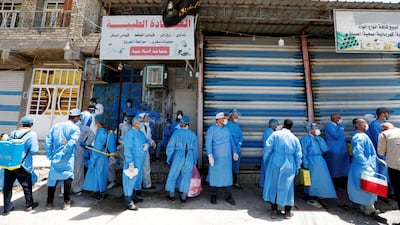 Healthcare workers prepare to test people for the coronavirus disease in Sadr city, Baghdad, Iraq. Reuters