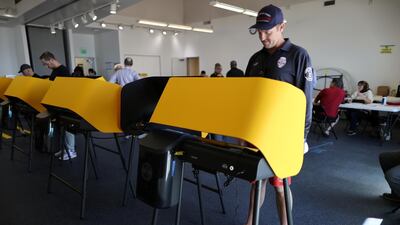 Lifeguard Erik Wylie, 43, votes at a polling station on Super Tuesday in Los Angeles, California, U.S. REUTERS/Lucy Nicholson