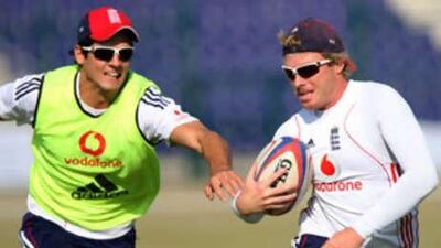 Alastair Cook, left, and Ian Bell play rugby at the Abu Dhabi Cricket Club on Dec 5 2008.